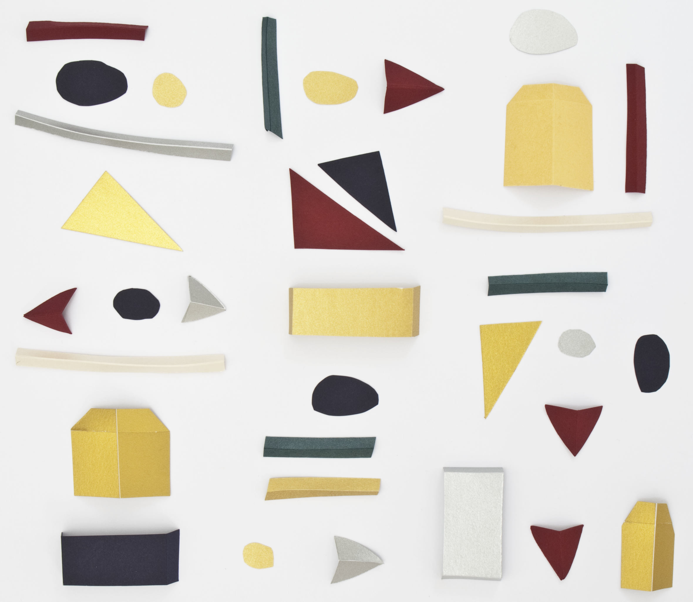 Paper-artwork. Cutted out paper forms arranged on neutral background.