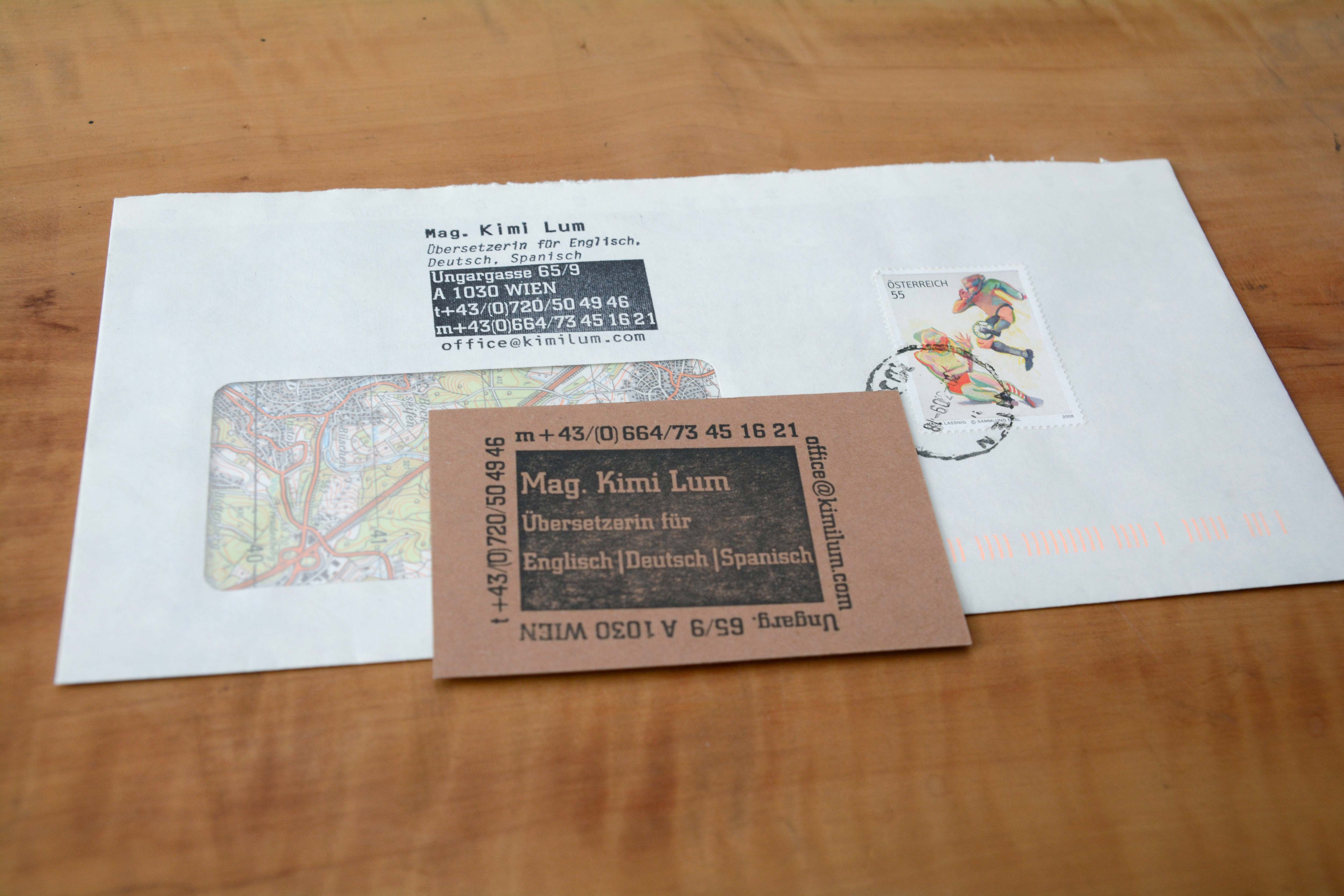 Business card translator. Text stamped on card.