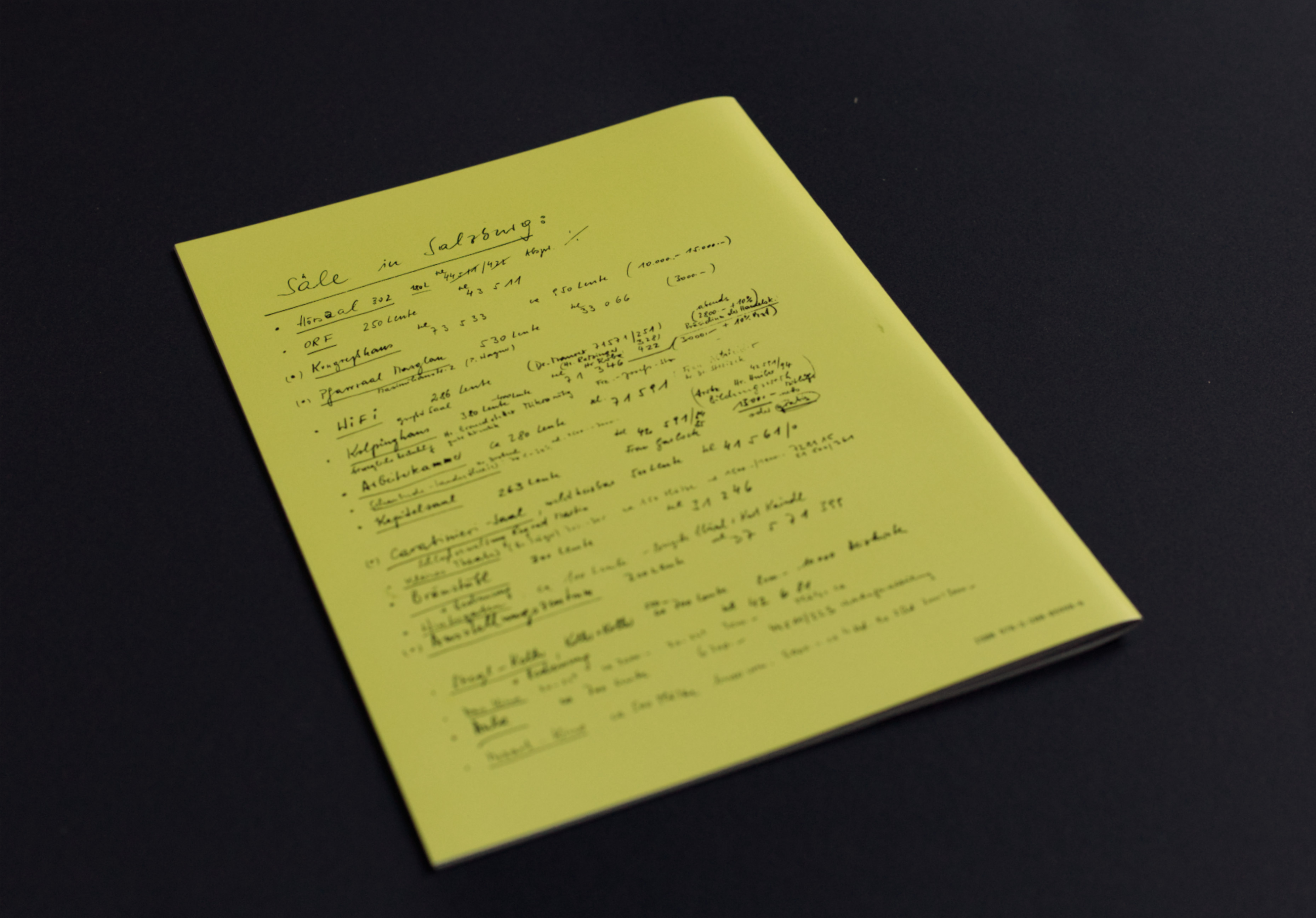 Back-cover brochure. Handwritten list on blank background.