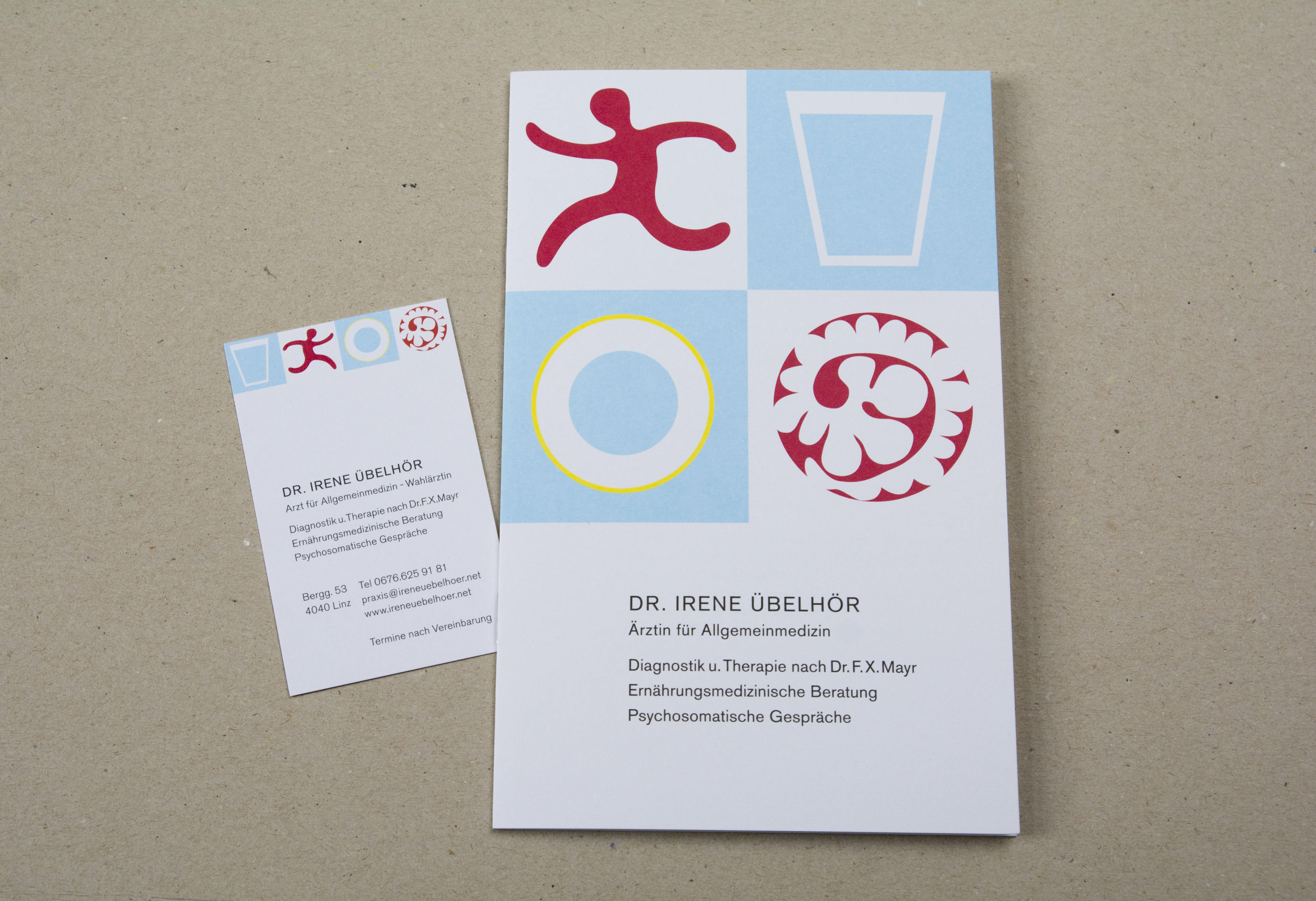 Folder and business card. 4 graphical images on top. Block of text underneath.