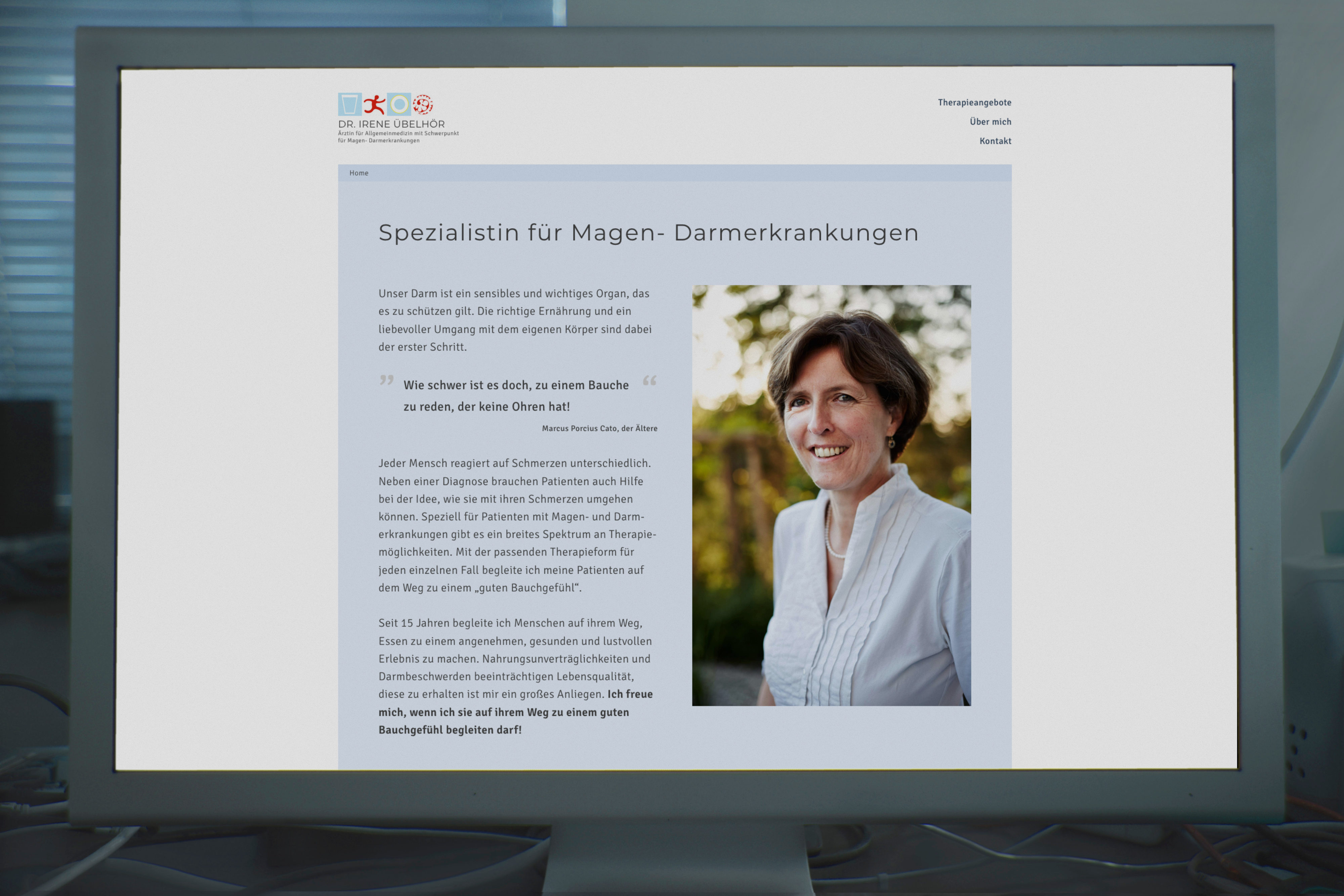 Desktop monitor with screenshot of home.