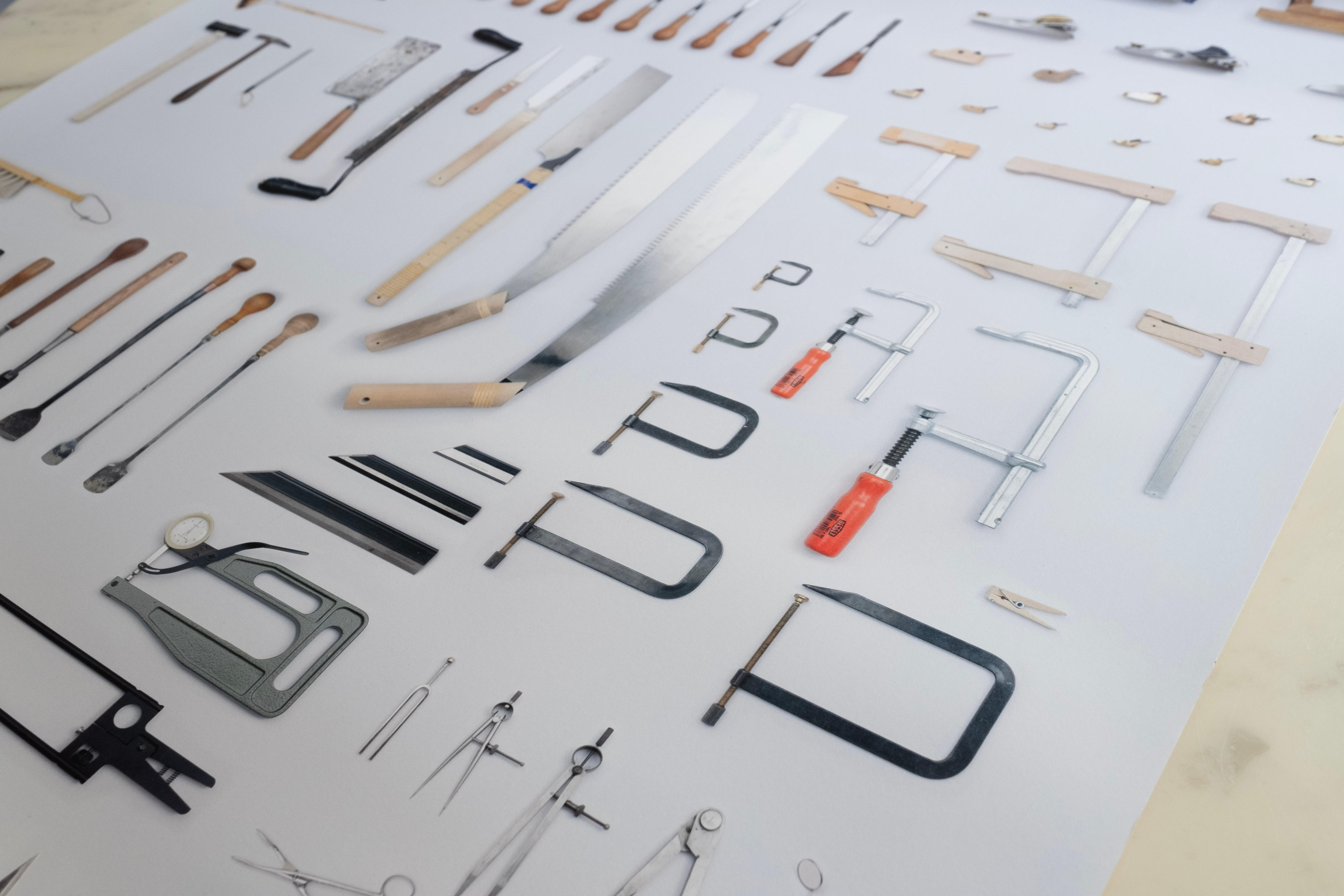 Close-up of poster. Arrangement of all tools from violin maker's workshop.