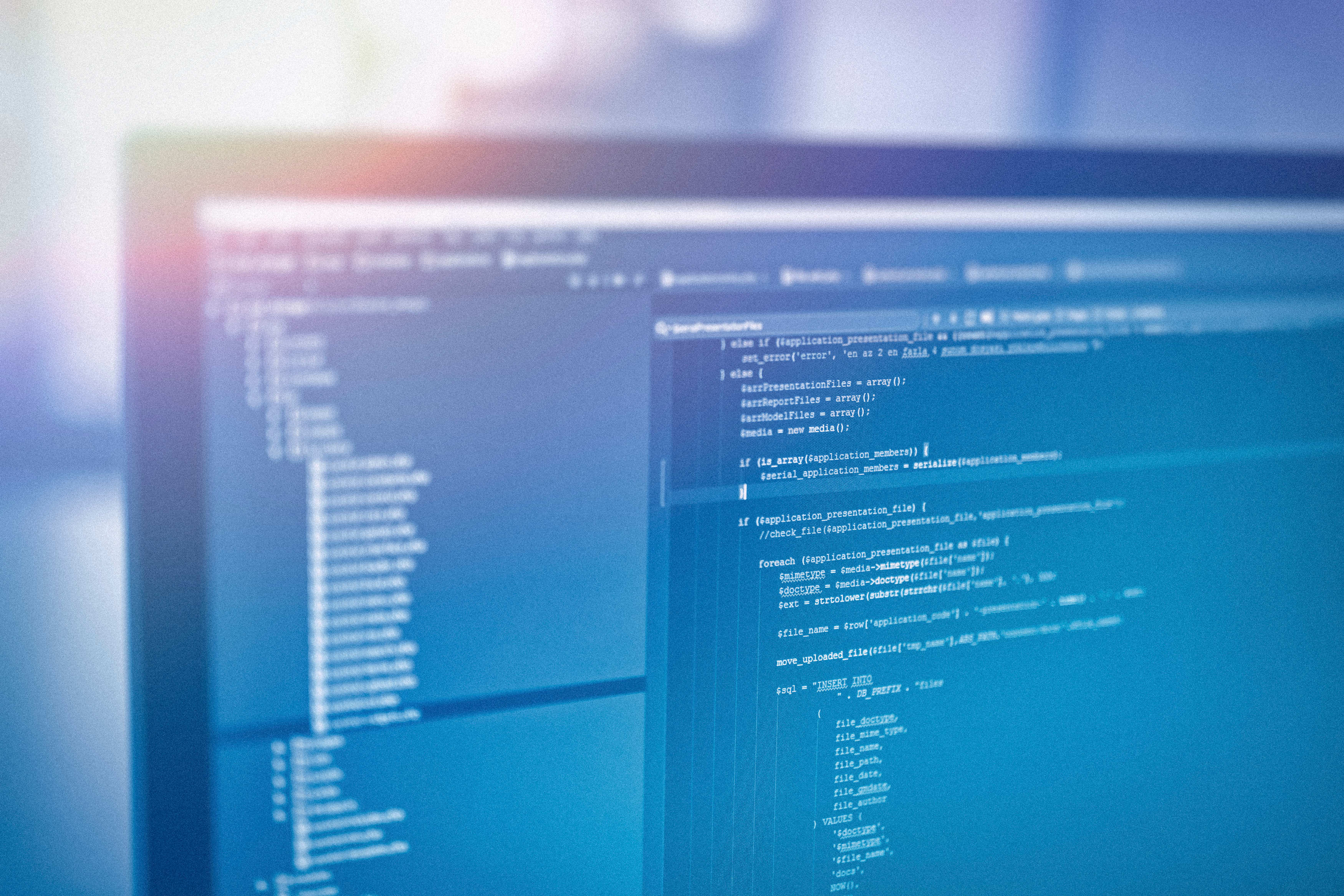Part of desktop monitor. Opened windows dispalying code-editors.