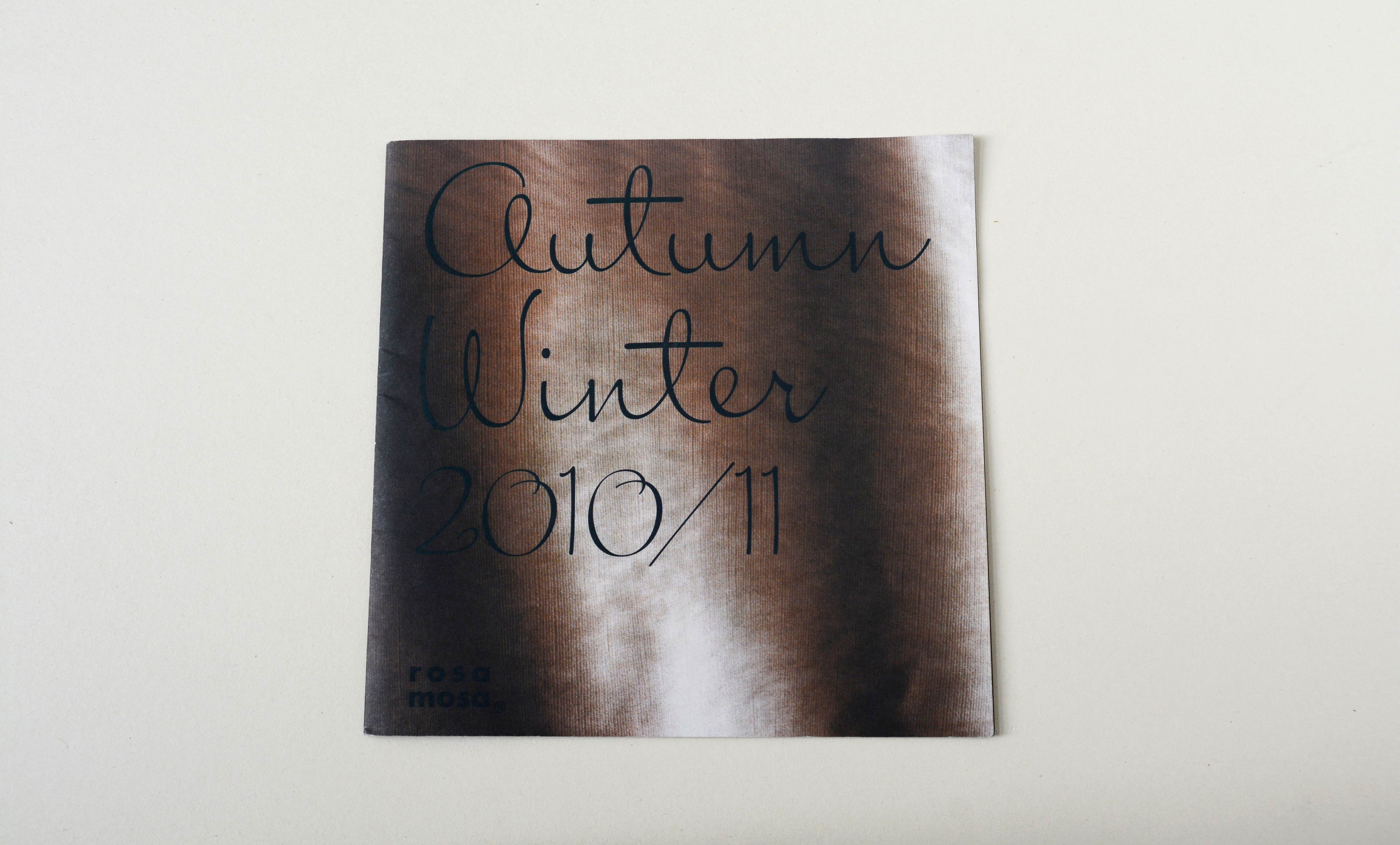 Lookbook cover front. In the background photo of fabric overlayed by title in script font.