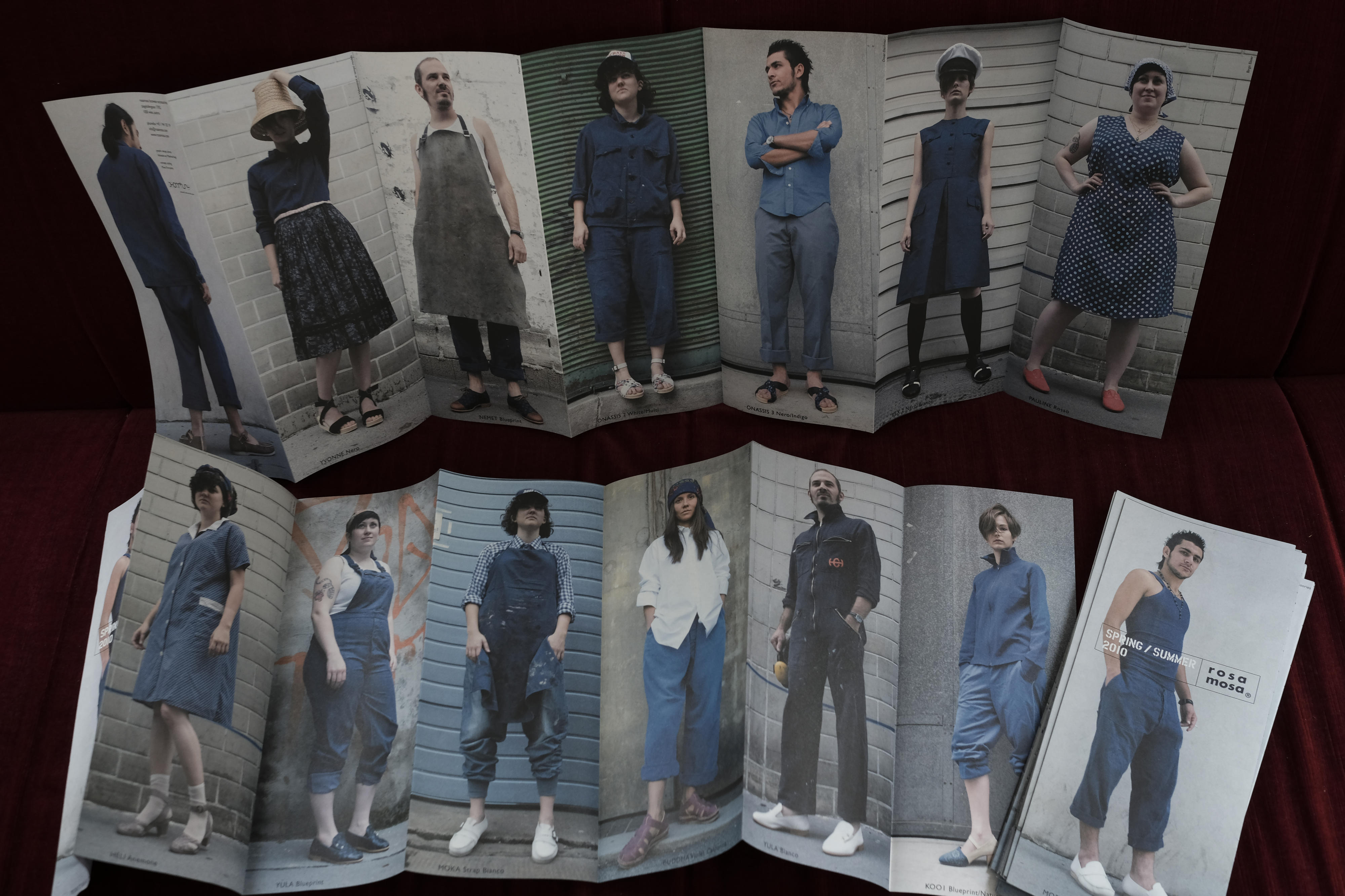 Front and back of unfolded catalogue placed on couch.