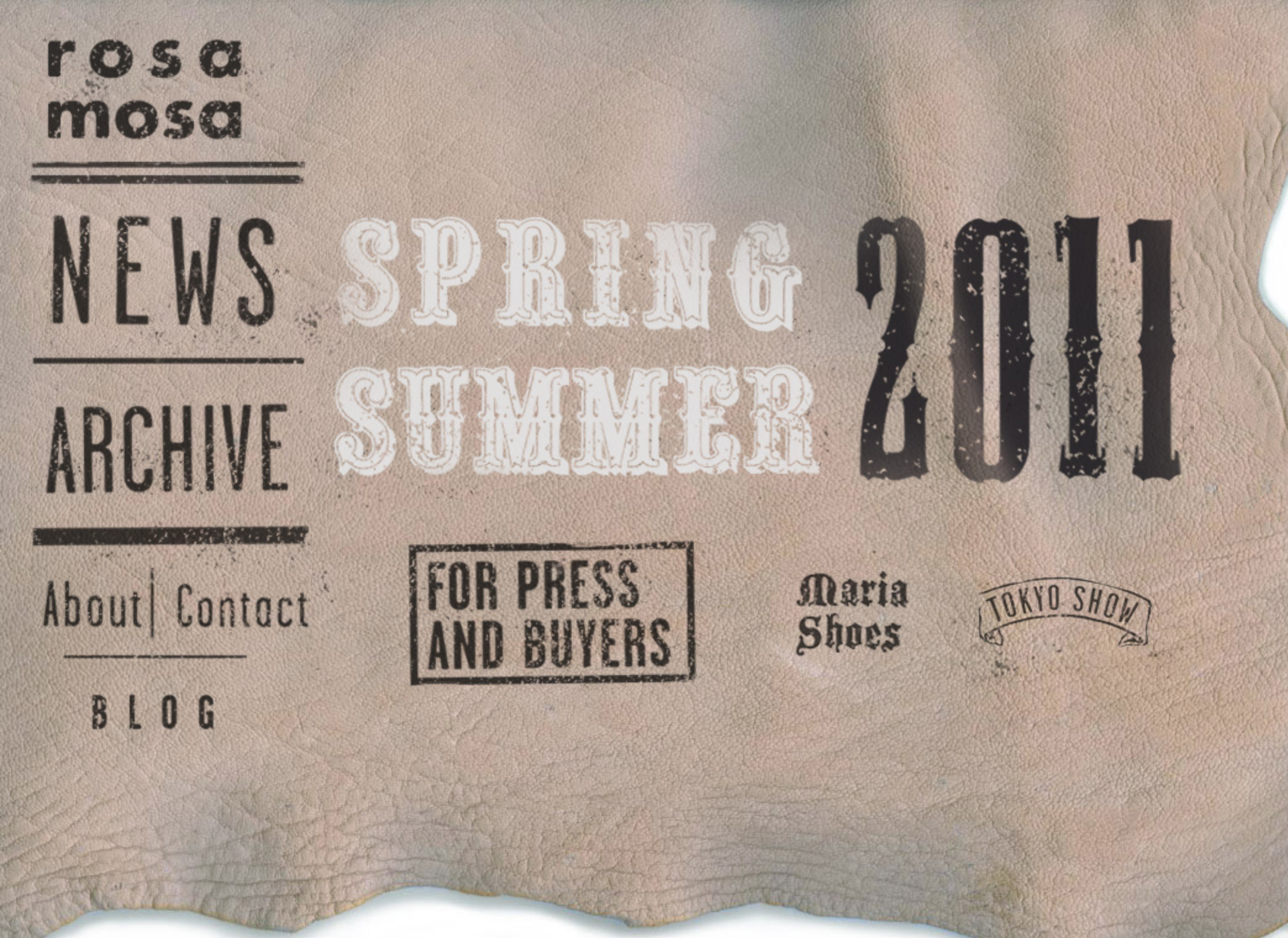 Website screenshot ss 11 collection. Navigation menu in various typographic letter-styles on leather background.