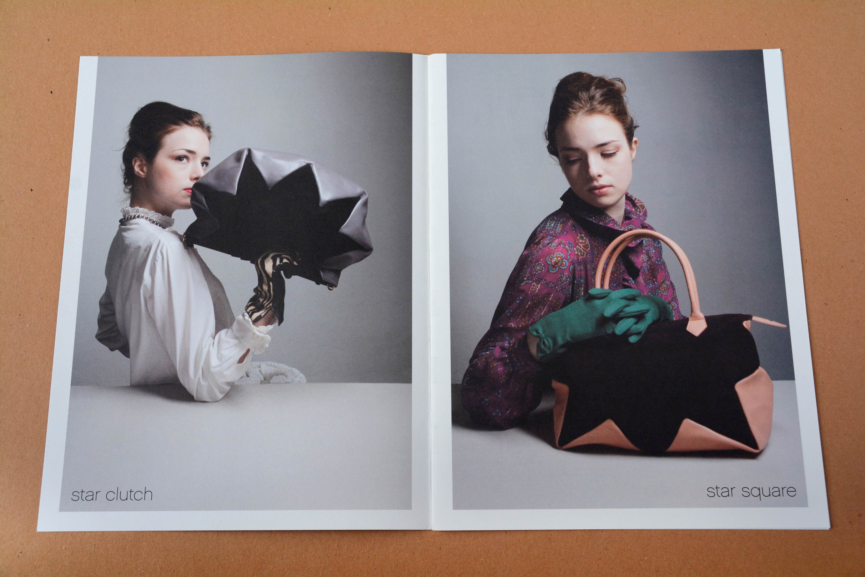 Double page. Full-page photos with partly white space around. Woman at a white table holding handbags in front of neutral background. Thin grotesque font overlayed at bottom.