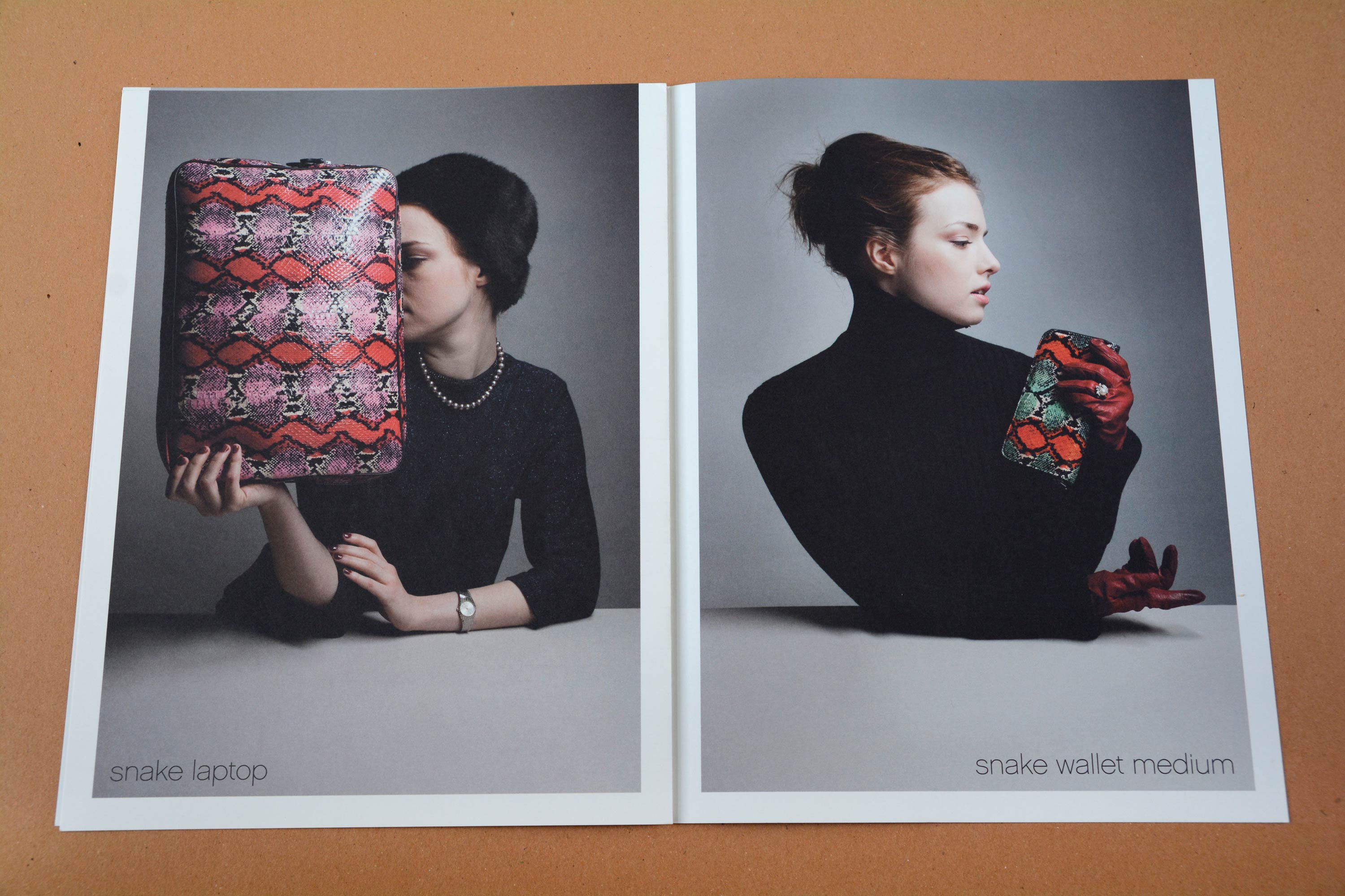 Double page. Full-page photos with partly white space around. Woman at a white table holding handbags in front of neutral background. Thin grotesque font overlayed at bottom.