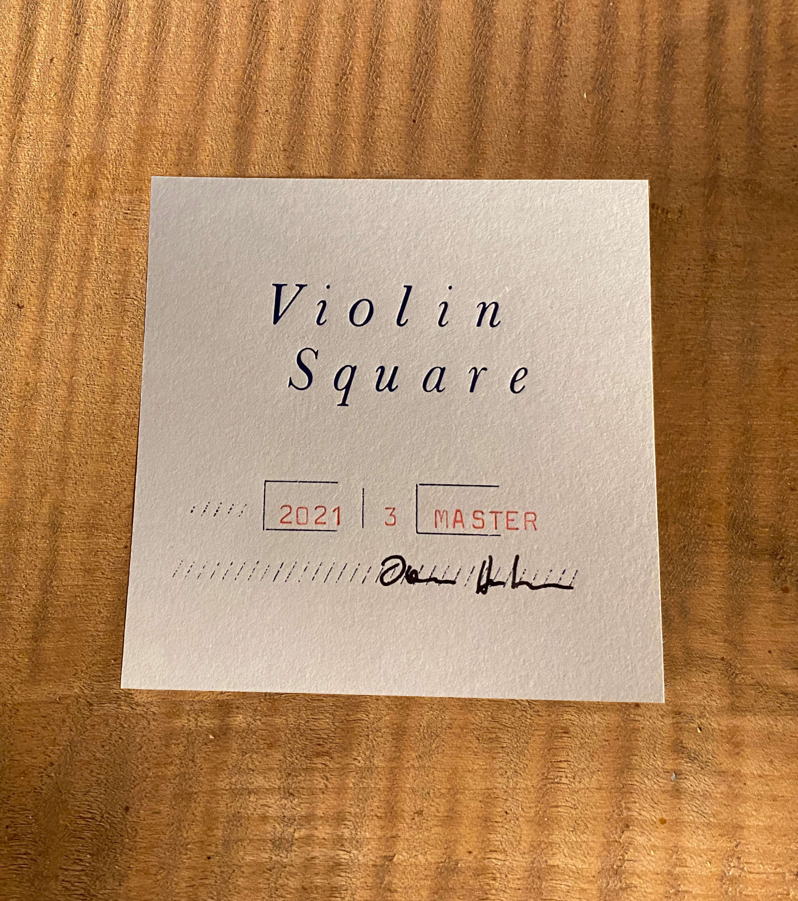 Another paper label inside body of instrument. Logo on top. Classifications and signature underneath.