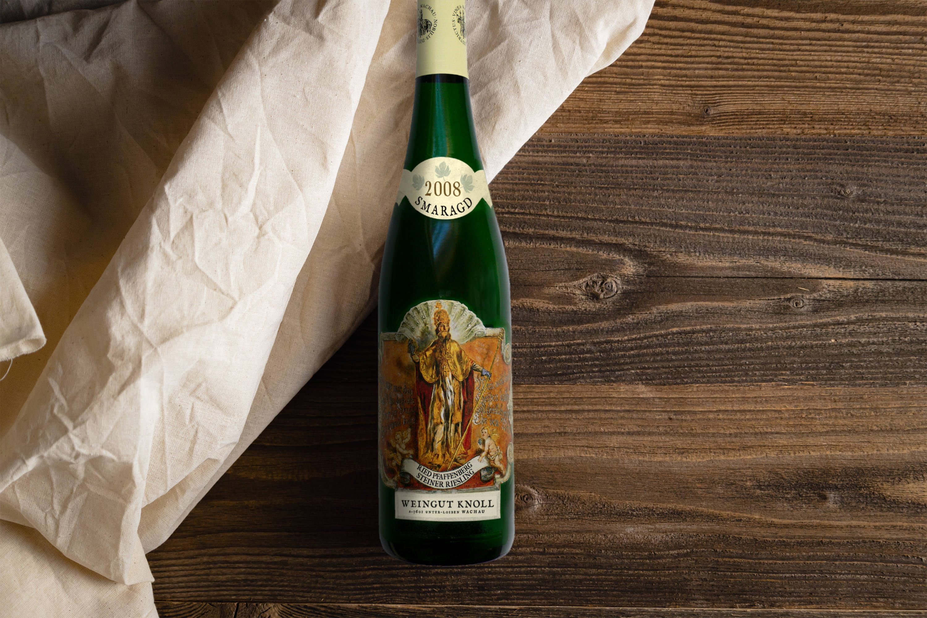 Wine bottle presenting label lying on wooden table.